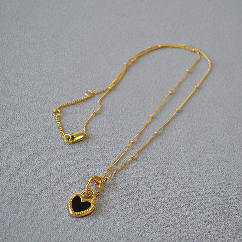 Gold Heart Pendant Necklace with White and Black Accents
