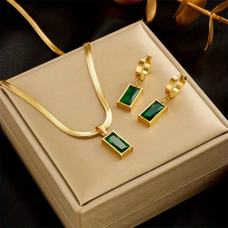 Carina Gold Earrings with Emerald Stone