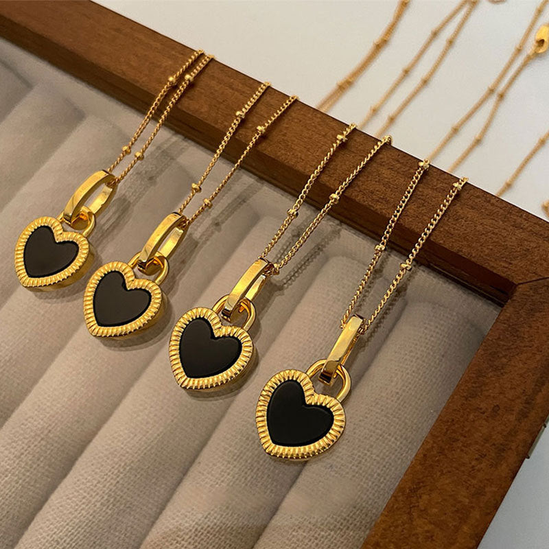 Gold Heart Pendant Necklace with White and Black Accents