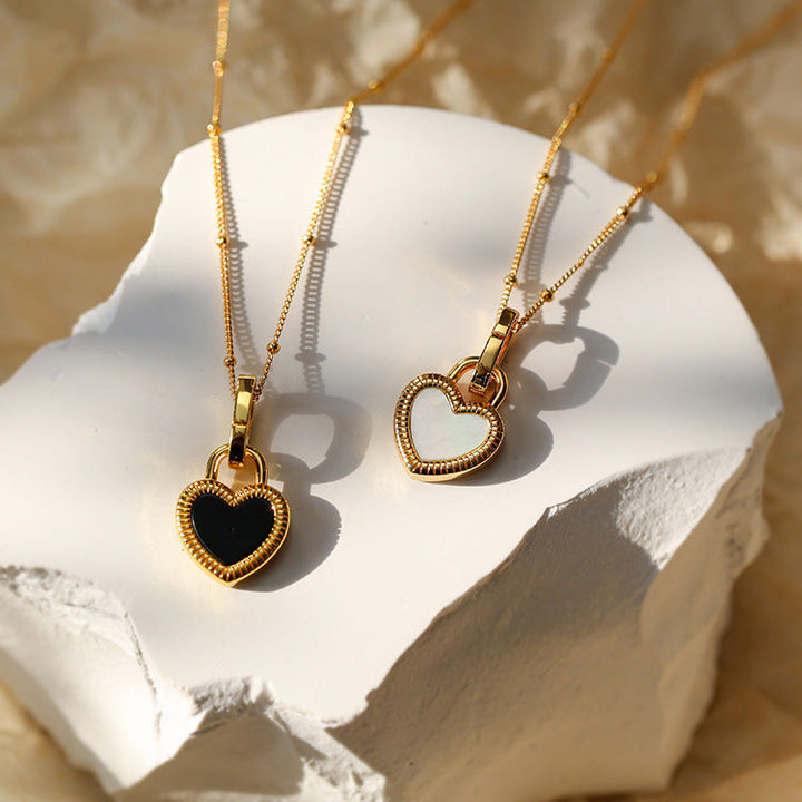 Gold Heart Pendant Necklace with White and Black Accents