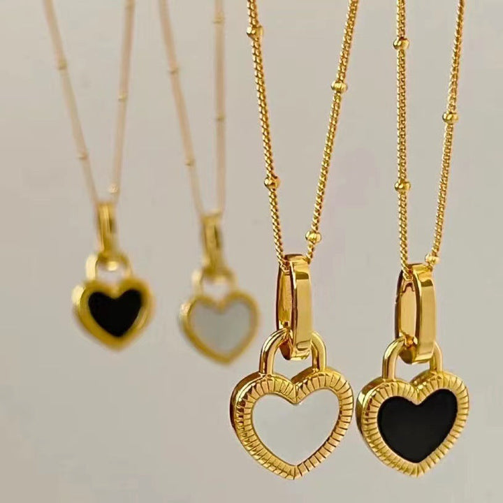 Gold Heart Pendant Necklace with White and Black Accents