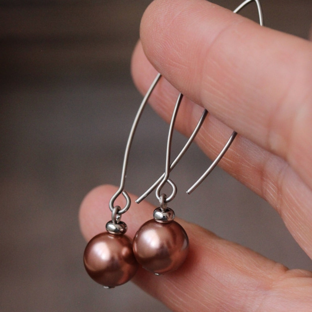 Bronze-Plated Pearl Drop Earrings" can be rewritten as "Bronze Pearl Drop Earrings.