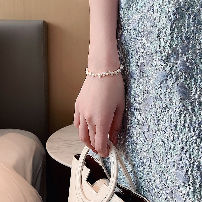 Céline Pearl Bracelet" can be rewritten as "Céline Pearl Charm Bracelet.
