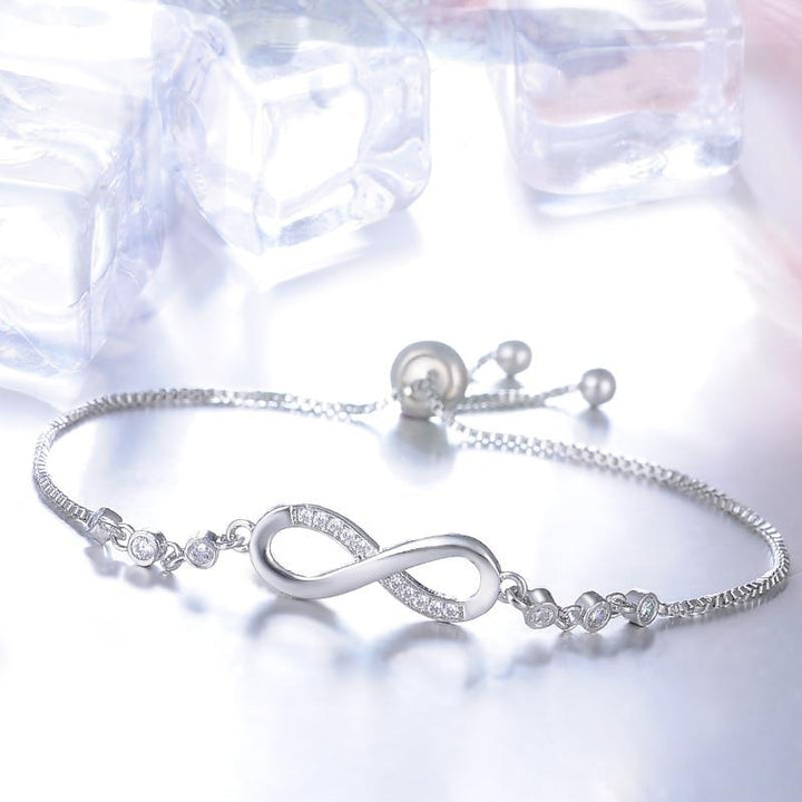 Adjustable Silver Infinity Bracelet" can be rewritten as "Adjustable Silver Infinity Charm Bracelet.