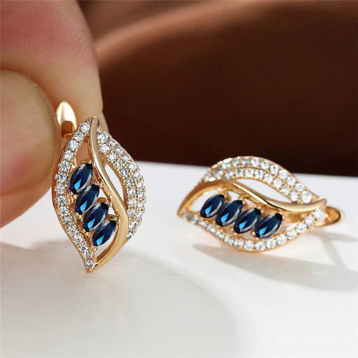 Golden Breeze Earrings" can be rewritten as "Golden Breeze Hoops.