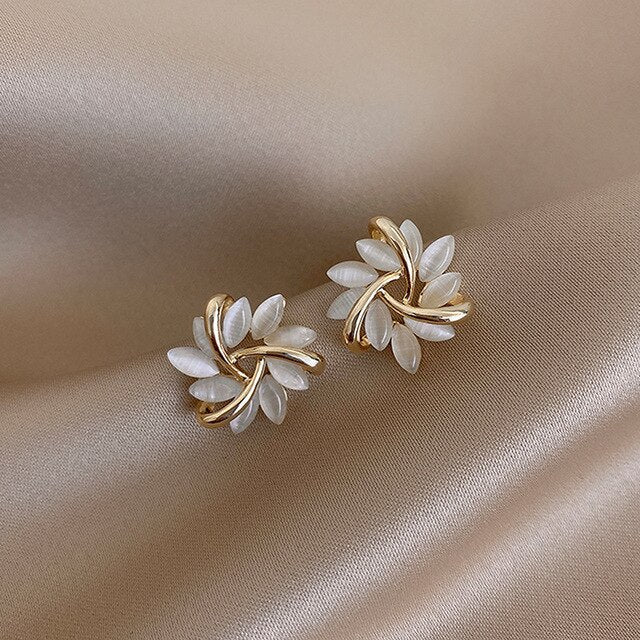 Sonja Luxe White Opal Earrings" can be rewritten as "Sonja Luxe Opal Earrings in White.