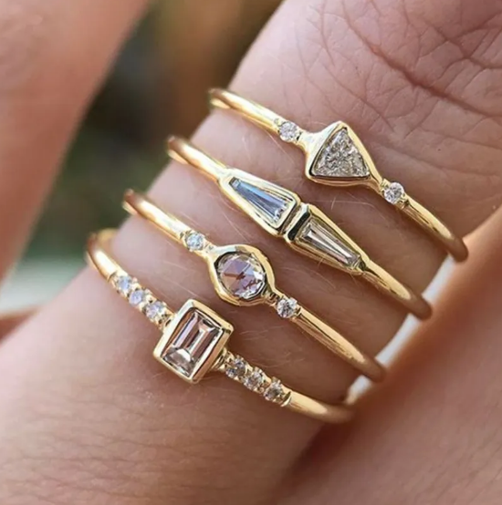 Square Zircon Ring with Four Diamonds" can be rewritten as: 

"Square Zircon Ring Featuring Four Diamonds