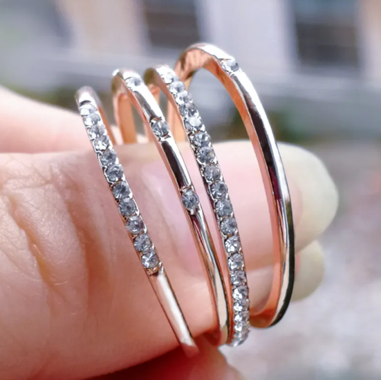Square Zircon Ring with Four Diamonds" can be rewritten as: 

"Square Zircon Ring Featuring Four Diamonds