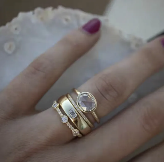 Square Zircon Ring with Four Diamonds" can be rewritten as: 

"Square Zircon Ring Featuring Four Diamonds