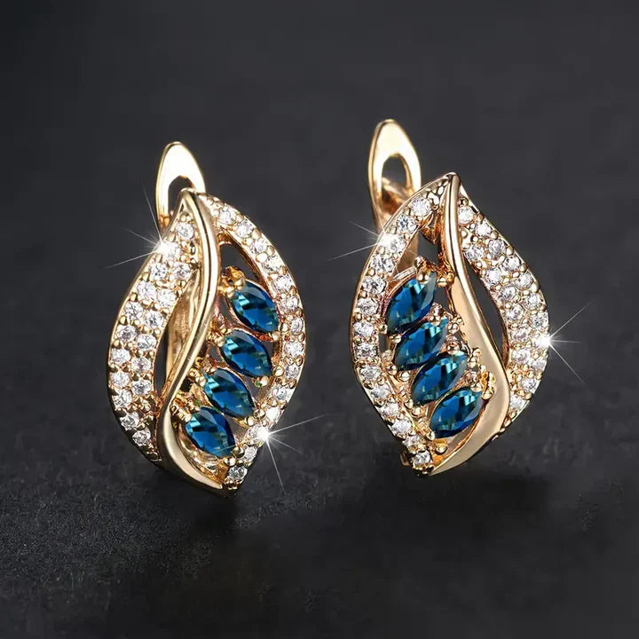 Isola Caelurelle Gold Earrings" can be translated and rewritten as "Isola Caelurelle Gold Hoop Earrings.