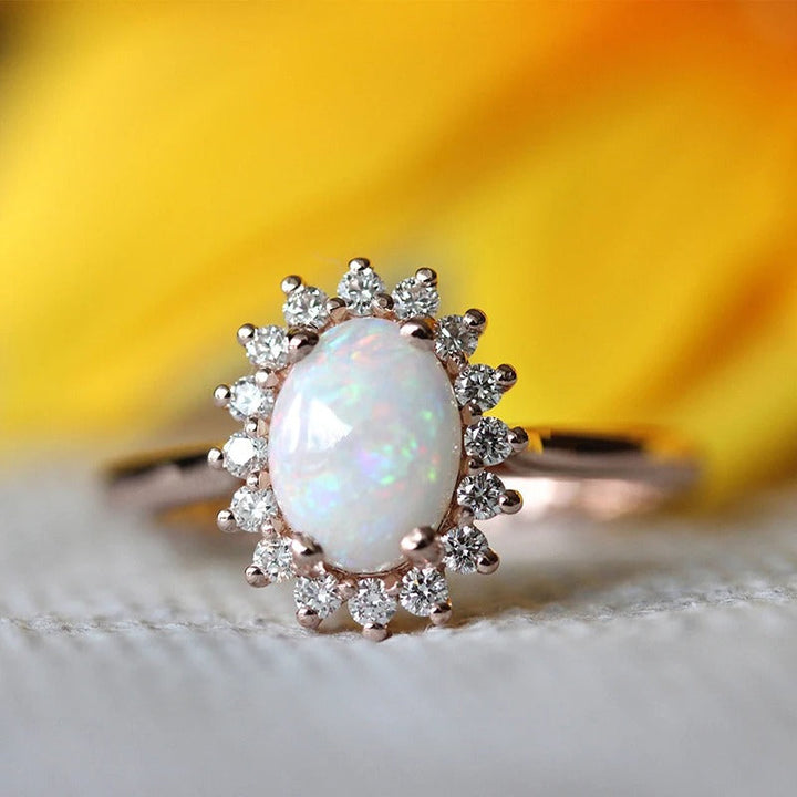 Vintage Rose Gold Oval Opal Ring with Sparkling Crystal Halo