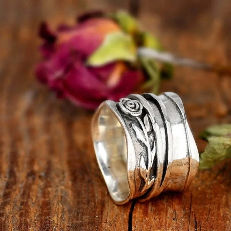 Floral Engraved Silver Ring" can be rewritten as "Silver Floral Engraved Ring.